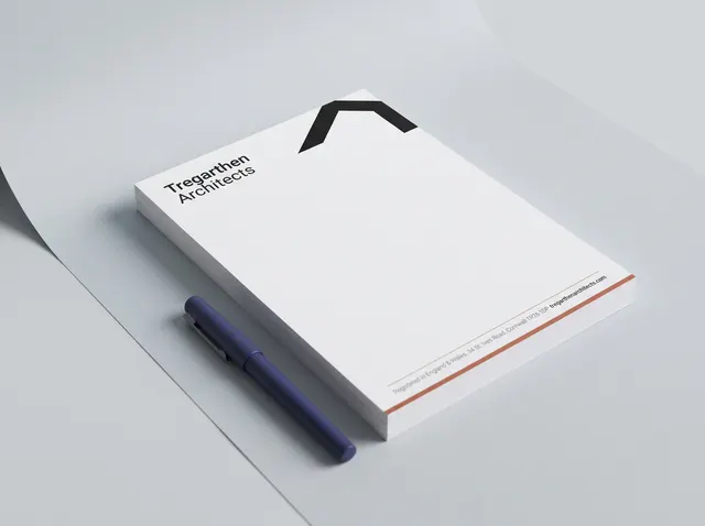 A stack of Tregarthen Architects letterheads with a bold black roof-line mark